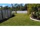 Large backyard with storage sheds and lush lawn at 18245 Ackerman Ave, Port Charlotte, FL 33948