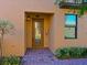 Front entrance with decorative glass door and brick walkway at 115 Red Fox Ct # 101, Bradenton, FL 34212