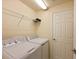 Laundry room with washer, dryer, and shelving at 115 Red Fox Ct # 101, Bradenton, FL 34212