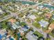 Aerial view highlighting the property, surrounding neighborhood, and lush landscaping at 334 7Th N Ave, Tierra Verde, FL 33715