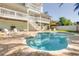 Inviting backyard featuring a private pool, lush landscaping, outdoor seating, and a multi-story home at 334 7Th N Ave, Tierra Verde, FL 33715