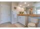 Well-lit bathroom with a granite countertop vanity and a walk-in shower at 334 7Th N Ave, Tierra Verde, FL 33715