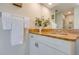 Bathroom features a long granite countertop with white cabinets and a towel rack at 334 7Th N Ave, Tierra Verde, FL 33715