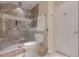 Modern bathroom features a glass-enclosed shower, neutral tile, and updated fixtures at 334 7Th N Ave, Tierra Verde, FL 33715