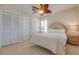 Bright bedroom with a decorative ceiling fan, side table lamps, and bright natural light at 334 7Th N Ave, Tierra Verde, FL 33715