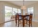 Dining area with counter-height table and chairs, plus sliding doors to a veranda at 334 7Th N Ave, Tierra Verde, FL 33715