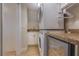 Laundry area with stacked washer and dryer, adjacent to counter and beverage cooler at 334 7Th N Ave, Tierra Verde, FL 33715