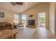 Cozy living room features a fireplace and stained-glass doors to the veranda at 334 7Th N Ave, Tierra Verde, FL 33715