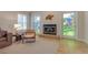 Relaxing living room features a fireplace, stained-glass doors, and neutral-toned decor at 334 7Th N Ave, Tierra Verde, FL 33715