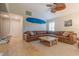 Bright living room offers unique decor, comfortable couches and views to the exterior at 334 7Th N Ave, Tierra Verde, FL 33715