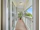 Inviting porch with a view of palm trees and lush greenery, perfect for enjoying the tropical landscape at 334 7Th N Ave, Tierra Verde, FL 33715