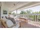 Comfortable porch with seating and tropical scenery at 334 7Th N Ave, Tierra Verde, FL 33715