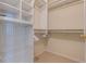 Walk-in closet with built-in shelving, hanging rods, and ample storage space at 334 7Th N Ave, Tierra Verde, FL 33715