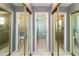 Bathroom features three mirrored sliding doors for storage at 7585 Kavanda St, North Port, FL 34287