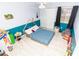 Bright bedroom with playful blue tones, ample closet space, and a comfortable layout designed for relaxation at 7585 Kavanda St, North Port, FL 34287