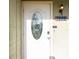 Close-up of the front door featuring decorative glass and a charming address plaque, adding to the home's curb appeal at 7585 Kavanda St, North Port, FL 34287