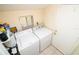 Laundry room includes a washer and dryer at 7585 Kavanda St, North Port, FL 34287