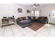 Living Room featuring a comfortable gray sectional sofa at 7585 Kavanda St, North Port, FL 34287