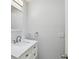 Bright bathroom featuring a white marble vanity, modern fixtures and a stylish mirror at 7405 Clearview Dr, Tampa, FL 33634