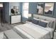 Comfortable bedroom features a plush bed, modern art, a bright window, and clean design at 16029 Arcaro Ave, Port Charlotte, FL 33954