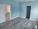 Bright, freshly painted room with modern flooring, baseboards and new doors, offering a clean and inviting space at 16029 Arcaro Ave, Port Charlotte, FL 33954