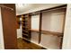 Walk-in closet with shelving and hanging rods for storage at 4250 Shamrock Dr, Venice, FL 34293
