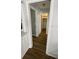 Hallway with wood floors leading to a closet and other rooms at 4250 Shamrock Dr, Venice, FL 34293