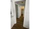 Hallway with wood floors leading to a closet at 4250 Shamrock Dr, Venice, FL 34293