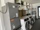 Laundry Room featuring updated washer and dryer units with lots of shelving and storage at 4250 Shamrock Dr, Venice, FL 34293