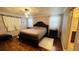 Spacious main bedroom with hardwood floors, warm colors, and decorative ceiling lights at 4250 Shamrock Dr, Venice, FL 34293