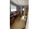 Office area with a window, desks, and closets for storage with neutral color walls at 4250 Shamrock Dr, Venice, FL 34293