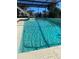 Inviting in-ground pool with clear water, enhanced by an attached pool cage at 4250 Shamrock Dr, Venice, FL 34293