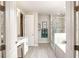 A luxurious bathroom with dual vanities, a walk-in shower, a soaking tub, and modern finishes at 25497 Calusa Dr, Punta Gorda, FL 33955