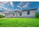Well-manicured lawn and pleasing contemporary architecture highlight this charming single Gathering home at 15245 Brainbridge Circle, Port Charlotte, FL 33981