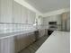 Modern kitchen with stainless steel appliances and ample counter space at 15245 Brainbridge Circle, Port Charlotte, FL 33981