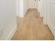 Light and bright hallway with wood-look tile flooring at 15245 Brainbridge Circle, Port Charlotte, FL 33981