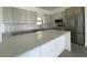 Modern kitchen with stainless steel appliances and quartz countertops at 15245 Brainbridge Circle, Port Charlotte, FL 33981