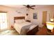 Cozy bedroom with a queen-size bed and direct access to the patio at 1104 S Moonmist Ct # M-10, Sarasota, FL 34242