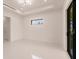 Minimalist bedroom with window and sliding glass doors at 24194 Peppercorn Rd, Punta Gorda, FL 33955