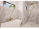 Modern bathroom with a freestanding tub and walk-in shower at 24194 Peppercorn Rd, Punta Gorda, FL 33955