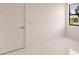 Bright bedroom featuring a large window and white walls at 24194 Peppercorn Rd, Punta Gorda, FL 33955