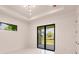 Bright bedroom with sliding glass doors to the backyard at 24194 Peppercorn Rd, Punta Gorda, FL 33955