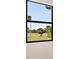 Window view of lush green landscape at 24194 Peppercorn Rd, Punta Gorda, FL 33955