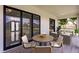 Covered patio with seating area, perfect for outdoor entertaining at 24194 Peppercorn Rd, Punta Gorda, FL 33955