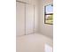 Bedroom with sliding closet doors and a window at 24194 Peppercorn Rd, Punta Gorda, FL 33955