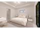 Bright bedroom with a king-size bed and sliding glass doors at 24194 Peppercorn Rd, Punta Gorda, FL 33955