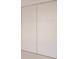 White sliding closet doors with horizontal detailing at 24194 Peppercorn Rd, Punta Gorda, FL 33955