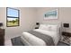 Bedroom with a queen bed and large window at 24194 Peppercorn Rd, Punta Gorda, FL 33955