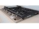 Stainless steel gas cooktop with five burners and griddle at 25491 Calusa Dr, Punta Gorda, FL 33955
