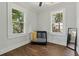 Charming bedroom with hardwood floors and two windows providing natural light at 922 E Ida St, Tampa, FL 33603